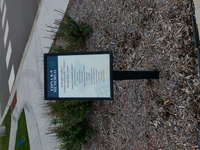 Informational sign for the Edina K-9 Memorial site