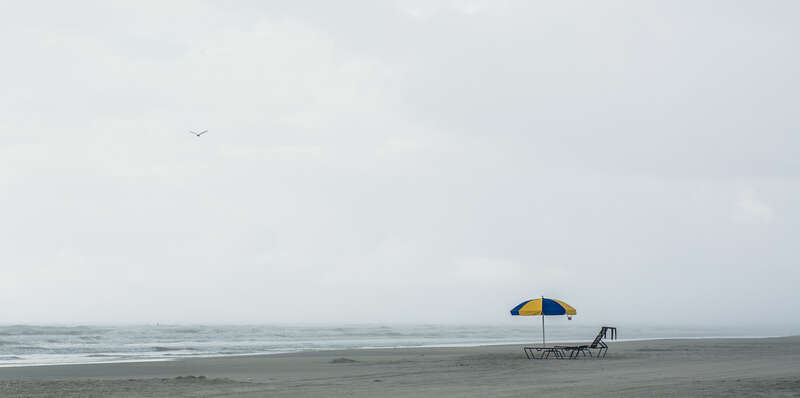 500px provided description: Emptiness [#umbrella ,#beach ,#cloudy ,#empty ,#loneless ,#Landscape ,#Ocean]
