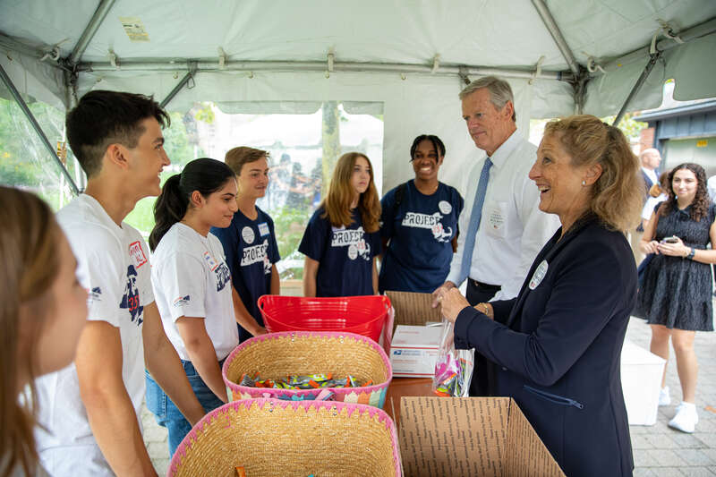 &quot;Governor Charlie Baker and First Lady Lauren Baker join state and local officials to make care packages for members of the military with the Massachusetts Military Heroes Fund and Project 351 in Boston on Sept. 11, 2022.&quot;