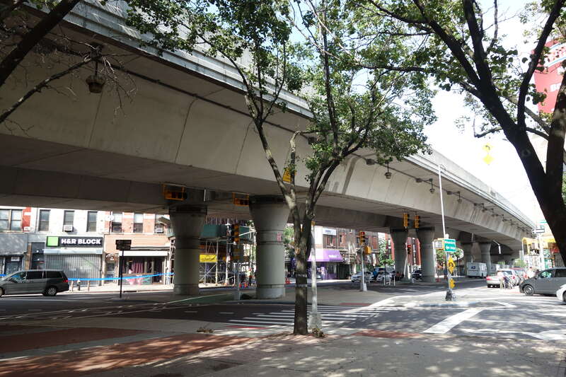 Looking from LaGuardia Playground South at the elevated highway spur running from the Williamsburg Bridge to the Brooklyn-Queens Expressway, at Havemeyer Street and South 4th Street in Williamsburg, Brooklyn. The highway trestle looks very modern,