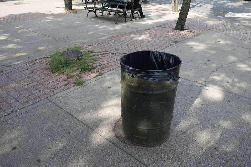Walking through the sitting plaza at the east end of LaGuardia Playground South, at the northwest corner of Havemeyer Street and South 5th Street in Williamsburg, Brooklyn. The park was originally the northern half of the Williamsburg Bride Plaza