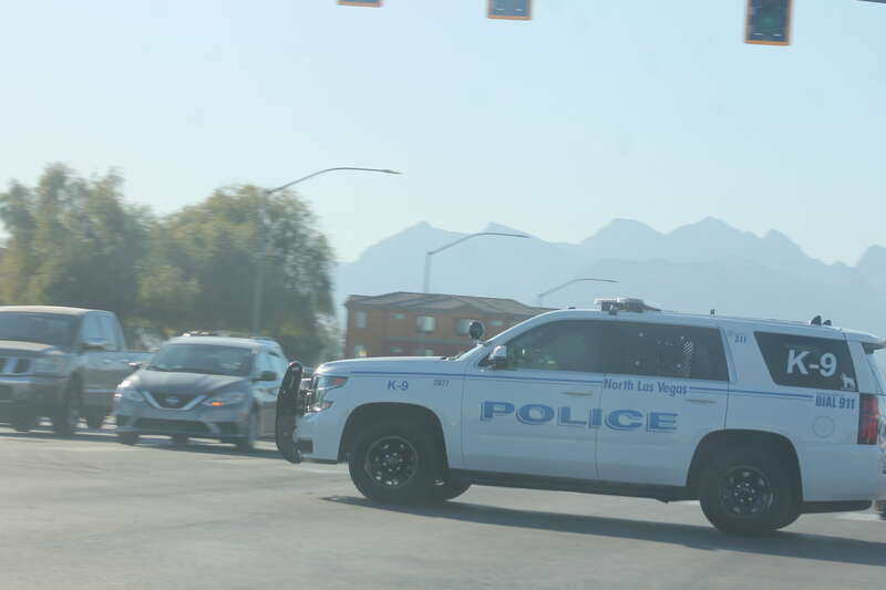 A Chevrolet Tahoe of the North Las Vegas Police Department K-9 Division driving through the intersection of Allen Lane and West Craig Road.