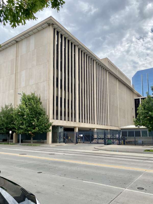 Built in 1965, this Modern New Formalist-style building was built as an annex to the adjacent Oklahoma County Courthouse.  The building features a stone-clad exterior with rectilinear columns, windows flanked by stone fins on the north and south