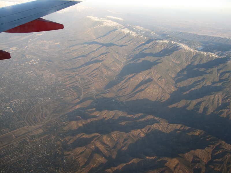 The San Bernardino Mountains are a high and rugged mountain range in Southern California in the United States. Situated north and northeast of San Bernardino and spanning two California counties, the range tops out at 11,489 feet (3,502 m) at San