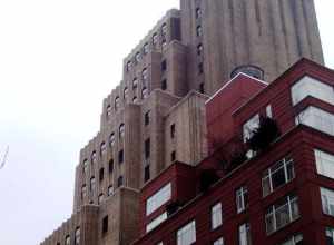 The Verizon telephone building at 215 West 17th Street, between Seventh and Eighth Avenue, in the Chelsea neighborhood of Manhattan, New York City, as seen from the east.  The building in the foreground is the Vesta 17 condominium building at 201