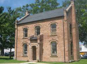 Chamber of Commerce Building in Center, Texas. This building is the original jail, built along with the historic courthouse. Both sit on the town square.