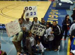 Kaleena Mosqueda -Lewis surrounded by friends and family after the UC Davis game where she tied the UConn record with ten three pointers made in a single game. She shares the record with Maya Moore