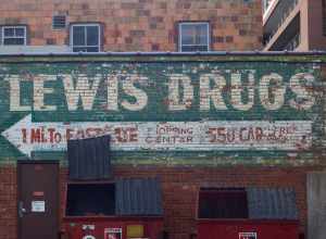 I don't know how old this ghost ad is, but I've always glanced at it as I pass by. It is downtown, right behind the Minervas resturant in the alley. It reminds me a little of the Wall Drug signs that dot I90 as I drive west. A few early morning