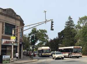 MBTA route 52 and BC shuttle buses in Newton Centre in September 2020