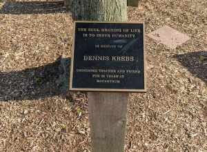 A black plaque in remembrance of Dennis Krebs MacArthur Middle school