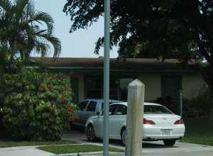 Old concrete sign post in Margate, Florida.