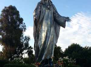 Statue of the Virgin Mary at Our Lady of Peace Shrine, Santa Clara. (Note for scale the venerators kneeling at her feet.)