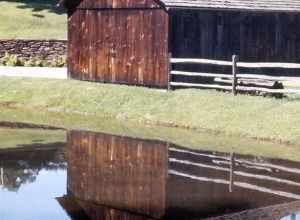 (1 in a multiple picture set)
While strolling throught the park one day (and it wasn't in the month of May), we found this quiet scene.  The water in the pond was perfectly still and the barn was relflected in total clarity.  A lovely place is