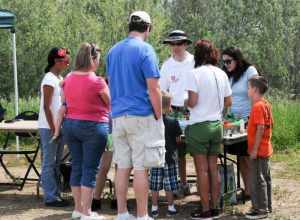ROSEVILLE, Calif. (April 18, 2011) -- U.S. Army Corps of Engineers Sacramento District regulatory project managers Zach Simmons (center) and Krystel Bell (right) use a watershed model to show how wetlands clean and filter water during the fourth