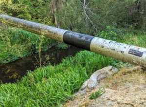 San Mateo Creek with high-pressure gas main crossing, below Crystal Springs Dam