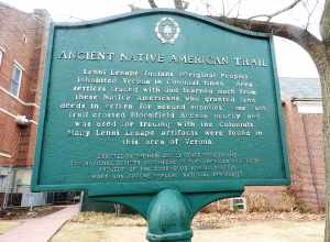 Looking west at sign in front of library
