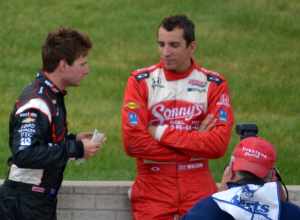 Will Power and Justin Wilson chat during the stoppage to the 2012 Detroit Belle Isle Grand Prix
