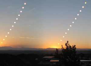 This is a composite panorama of three sunrises, showing the sun's path in the sky at the solstices and equinoxes.
Three separate time-lapse photographs were made of a sunrise, once on the summer solstice (the left or more northerly sunrise), once on