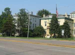 Houses in the 400 block of SE. Riverside Drive in Evansville, Indiana, United States.  From left to right:
408 Riverside: Jabez Woolley House, Neoclassical, built 1895.
414 Riverside: Richard Raleigh House, Italianate, built 1870.
420 Riverside: John