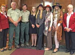 From left, Director of the Queens Department Melanie Dempsey, Monongahela National Forest Deputy Forest Supervisor Ray Torres, Forest Supervisor Shawn Cochran, Forest Princess Jessica Stevens, Maid Silvia Kaitlin Smith, Maids of Honor Christine