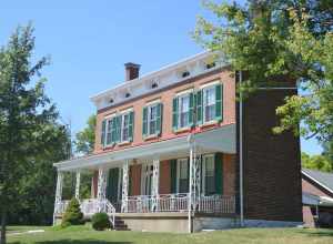 Front and eastern end of the Kruempelman Farmhouse, located at the junction of Kruempelman Drive and St. Johns Road in Fort Mitchell, Kentucky, United States.  Built in 1890, it is listed on the National Register of Historic Places.