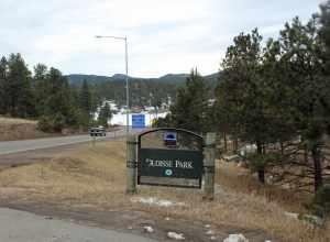 Dedisse Park, located in Evergreen, Jefferson County, Colorado. The park is one of the Denver Mountain Parks. The road on the left of the picture is State Highway 74, and the frozen lake at the bottom of the hill is Lake Evergreen.