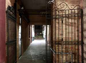 A gated passage under a building in downtown Bowling Green, Ohio.