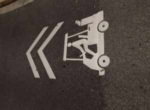 Sharrows on Annunciation Circle in Ave Maria, FL that depict a golf cart instead of a bicycle.