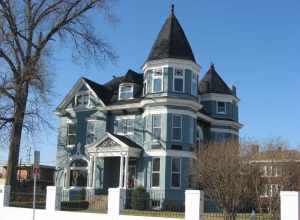 Front and eastern side of the James J. Sweeney House, located at 121 E. Fifth Street in Owensboro, Kentucky, United States.  Built in 1893, it is listed on the National Register of Historic Places.