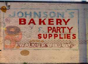 Building mural illustrating Johnson's Bakery serving the Lawton area and surrounding communities for many decades during the twentieth century. The bakery created scrumptious brownies, cakes, donuts, and pastries for the Southwest Oklahoma region.