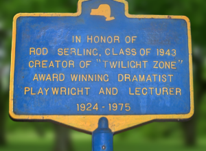 Memorial sign for Rod Serling, located on the grounds of Binghamton High School, Main Street between Front Street and Oak Street, Binghamton, New York, United States.  This sign sometimes faces the street and at other times gets turned perpendicular