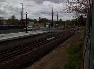 Westside Express Service commuter rail platform next to Tigard Transit Center.  Note the gauntlet track that allows passenger trains to get close to the platform while allowing good clearance for freight trains.