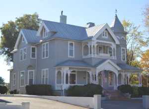 Front and eastern side of the John Waddey Carter House, located at 324 E. Church Street in Martinsville, Virginia, United States.  Built in 1896, it is listed on the National Register of Historic Places, and it is located in a Register-listed