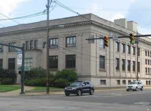 Front and southern side of the Reuben McMillan Free Library, located on the northeastern corner of Rayen (State Route 289) and Wick Avenues in Youngstown, Ohio, United States.  Built in 1909, it is listed on the National Register of Historic Places.