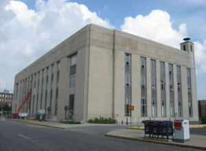 Front and western side of the Terre Haute Post Office and Federal Building, located at the junction of Seventh and Cherry Streets in Terre Haute, Indiana, United States.  Built in 1932, it is listed on the National Register of Historic Places.