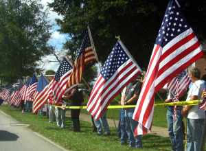 Bradley County residents lined Ocoee street in Cleveland, TN to show their support of Sgt. David Weir, who was recently killed in Iraq.  These flag wavers lined the street an hour early to see the funeral motorcade of the slain soldier.  One of the