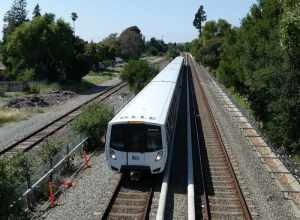 A southbound Green Line train viewed from the Sycamore Avenue footbridge in Hayward in May 2024