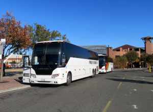 Amtrak Thruway Motorcoach buses at Martinez station in November 2019. One bus will head to Napa via Vallejo, and the other to Arcata via Santa Rosa.